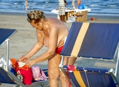 Naked old nudist at the beach. This aged